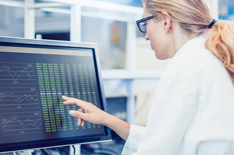 Researcher reviewing data on computer