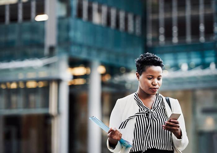 businesswoman using smart phone in the city