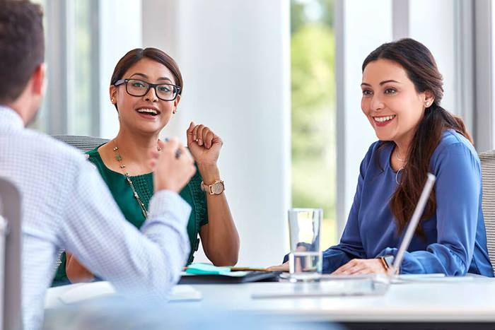 coworkers discussing ideas and working together