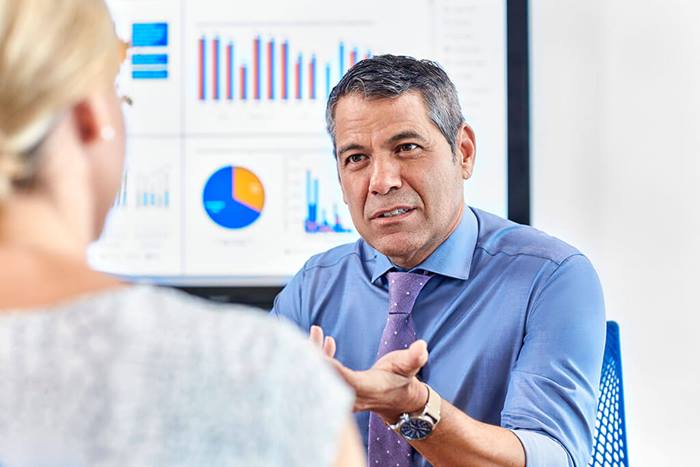 man talking to his colleague